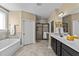 Bright bathroom featuring double vanity, soaking tub, and tiled walk-in shower at 420 Carsons Creek Trl, Wendell, NC 27591
