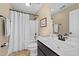 A traditional bathroom featuring a shower, toilet, vanity, and mirror providing essential functionality at 420 Carsons Creek Trl, Wendell, NC 27591