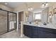 Bright bathroom featuring double vanity, soaking tub, and tiled walk-in shower at 420 Carsons Creek Trl, Wendell, NC 27591