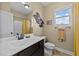 Well-lit bathroom featuring a decorative sink and shower with curtain at 420 Carsons Creek Trl, Wendell, NC 27591