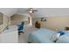 A cozy bedroom features an office area, a ceiling fan, neutral walls, and carpeted floors, offering comfort and functionality at 420 Carsons Creek Trl, Wendell, NC 27591