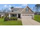 Charming single-Gathering home features a manicured lawn, inviting front porch, and two-car garage at 420 Carsons Creek Trl, Wendell, NC 27591