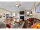 Inviting living space with hardwood floors, fireplace, and a cozy seating arrangement for entertaining at 420 Carsons Creek Trl, Wendell, NC 27591