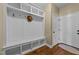 Bright mudroom features custom built-in storage and a doorway to an adjacent room at 420 Carsons Creek Trl, Wendell, NC 27591