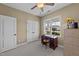 Bright office space with a ceiling fan and desk area at 420 Carsons Creek Trl, Wendell, NC 27591