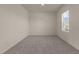 Cozy bedroom with plush carpet and natural light from a window at 44 Rolling Banks Dr, Louisburg, NC 27549