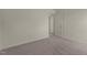 A bright bedroom with neutral carpet and a door leading to another room at 44 Rolling Banks Dr, Louisburg, NC 27549