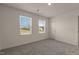 A sun-lit bedroom featuring two windows at 44 Rolling Banks Dr, Louisburg, NC 27549