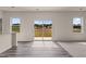 Bright living room with wood floors and sliding glass doors to the backyard at 44 Rolling Banks Dr, Louisburg, NC 27549