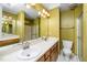 Bathroom featuring a double sink, shower, toilet, and vanity with bright lighting at 4628 Townesbury Ln, Raleigh, NC 27612