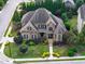 Stunning aerial view of a landscaped property with lush greenery and elegant curb appeal at 5026 Clyden Cv, Raleigh, NC 27612
