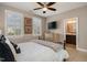 Comfortable bedroom with ceiling fan, television, and ensuite bathroom at 5026 Clyden Cv, Raleigh, NC 27612