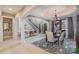 Dining room with neutral decor, decorative ceiling, and views into the entry and living room at 5026 Clyden Cv, Raleigh, NC 27612