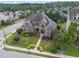 A stately brick home showcases a manicured lawn and garden beds bursting with lush, colorful foliage at 5026 Clyden Cv, Raleigh, NC 27612