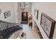 Grand foyer with staircase, high ceilings, chandelier, and art-adorned walls, providing a welcoming entrance to the home at 5026 Clyden Cv, Raleigh, NC 27612