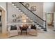 Elegant foyer with staircase, neutral walls, and tiled floor at 5026 Clyden Cv, Raleigh, NC 27612