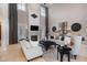 Bright living room with high ceilings, neutral decor, fireplace, and tall windows at 5026 Clyden Cv, Raleigh, NC 27612