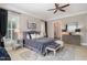 Beautiful bedroom featuring a comfortable bed, stylish decor, and plenty of natural light from the windows at 5026 Clyden Cv, Raleigh, NC 27612