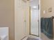 Bathroom with walk-in shower, tiled walls, and towel bar at 715 Thompson Rd, Garner, NC 27529