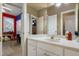 Bathroom featuring a white vanity and a glimpse of the adjacent bedroom at 715 Thompson Rd, Garner, NC 27529