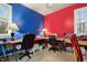 Creative room with red and blue walls, perfect for a craft or hobby room with natural light at 715 Thompson Rd, Garner, NC 27529
