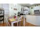Charming breakfast nook adjacent to the kitchen, featuring a wooden table and matching chairs at 715 Thompson Rd, Garner, NC 27529