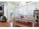 Cozy breakfast nook with a wooden table, chairs, bench, and plenty of natural light at 715 Thompson Rd, Garner, NC 27529