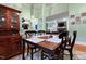 Formal dining room with a wooden table, hardwood floors, and decorative furnishings at 715 Thompson Rd, Garner, NC 27529