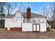 Exterior view of the house featuring a large deck and outdoor storage access at 715 Thompson Rd, Garner, NC 27529