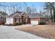 Beautiful home with brick and white siding, a two-car garage, and a well-maintained driveway at 715 Thompson Rd, Garner, NC 27529
