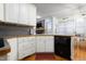 Traditional kitchen featuring white cabinetry, wood countertops, and stainless steel appliances at 715 Thompson Rd, Garner, NC 27529