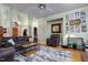 Inviting living room with hardwood floors, a ceiling fan, and neutral paint at 715 Thompson Rd, Garner, NC 27529