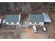 Aerial view of detached garages with solar panels, showcases ample parking, and potential for sustainable energy use at 721 Thompson Rd, Garner, NC 27529