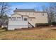 Expansive backyard features a deck, stairs and mature landscaping at 721 Thompson Rd, Garner, NC 27529