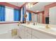 Bathroom with dual sinks, soaking tub, and separate shower provides comfort and style at 721 Thompson Rd, Garner, NC 27529