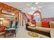 Bonus room with cozy seating, natural light, and decorative sports memorabilia at 721 Thompson Rd, Garner, NC 27529
