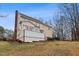 A beautiful, tan house in the backyard with a deck that has patio furniture at 721 Thompson Rd, Garner, NC 27529