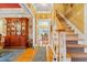 Bright foyer with hardwood floors and staircase, showcasing elegant décor and an inviting entry way to the home at 721 Thompson Rd, Garner, NC 27529