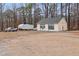Spacious detached garage with multiple bays, ample parking, and workshop space at 721 Thompson Rd, Garner, NC 27529