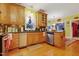 Well-lit kitchen with wooden cabinets, stainless steel appliances, and granite countertops, ready for culinary adventures at 721 Thompson Rd, Garner, NC 27529