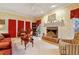 Spacious living room featuring a brick fireplace and comfortable seating at 721 Thompson Rd, Garner, NC 27529