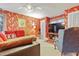 Vibrant living room with comfortable seating, a large TV and unique wall designs at 721 Thompson Rd, Garner, NC 27529