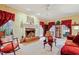 Elegant living room featuring a brick fireplace, classic decor, and ample seating at 721 Thompson Rd, Garner, NC 27529