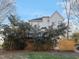 Two-story home's rear exterior featuring a deck and a spacious backyard at 725 Littleleaf Ct, Holly Springs, NC 27540