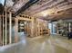 Unfinished basement with exposed framing, insulation, and concrete floor at 725 Littleleaf Ct, Holly Springs, NC 27540