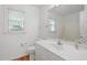 Bathroom featuring a window, sink, toilet and mirror at 725 Littleleaf Ct, Holly Springs, NC 27540