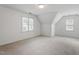 Spacious bedroom with an angled ceiling and carpet flooring at 725 Littleleaf Ct, Holly Springs, NC 27540