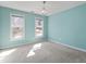 Bright bedroom with natural light, neutral carpet, and a chandelier at 725 Littleleaf Ct, Holly Springs, NC 27540