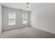 Cozy bedroom featuring chandelier light and two windows at 725 Littleleaf Ct, Holly Springs, NC 27540
