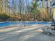 Inviting community pool area with plenty of seating for residents to enjoy at 725 Littleleaf Ct, Holly Springs, NC 27540